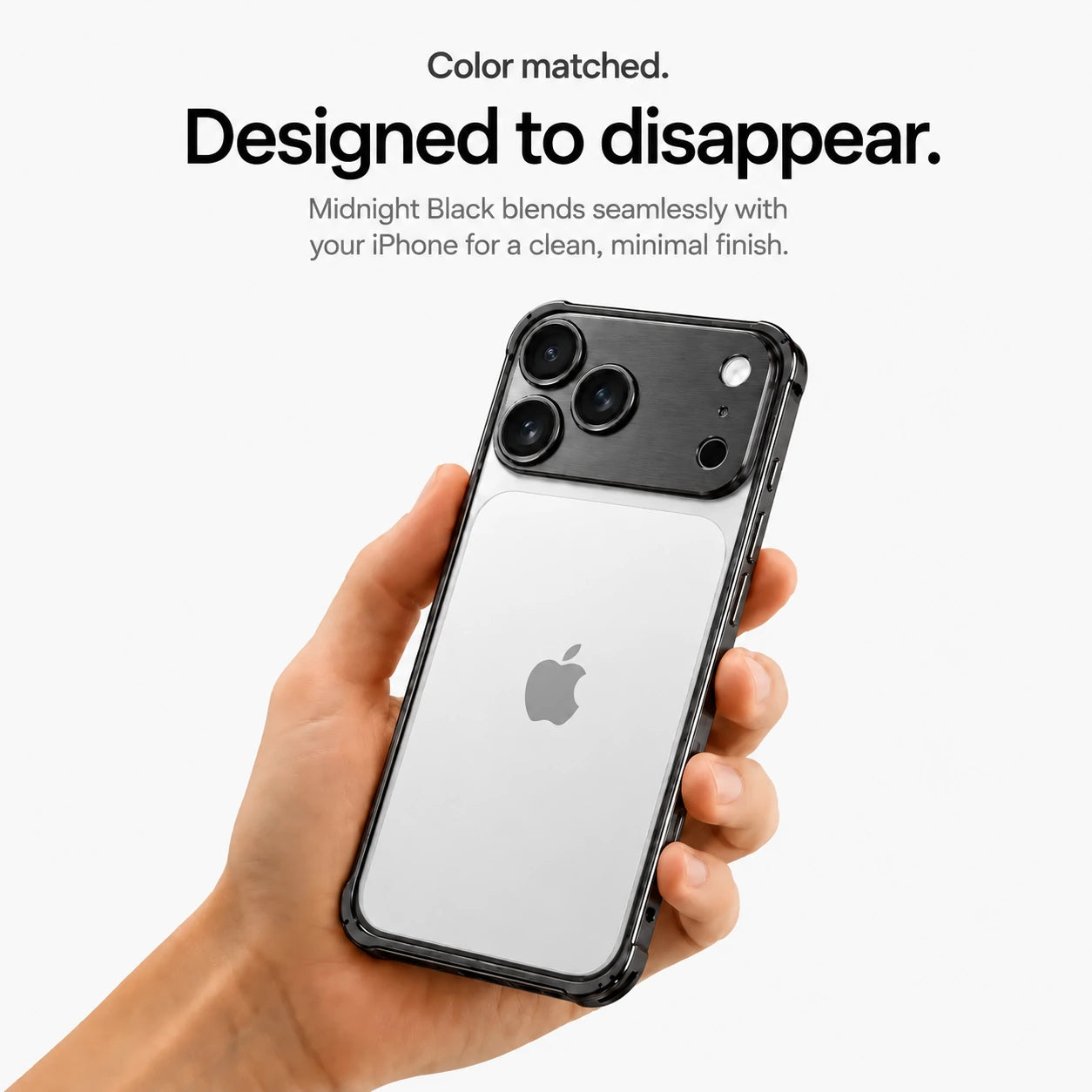 Black aluminum frame phone case held in a hand showing its open back #color_Midnight Black