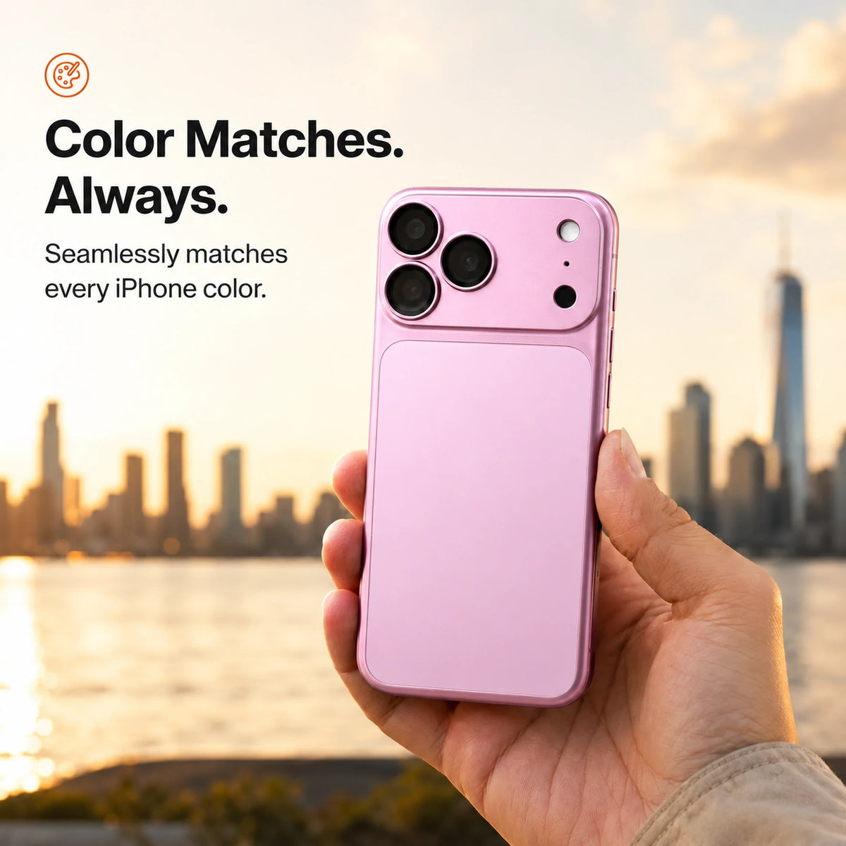 Blush Pink magnetic protective phone backplate held against a city skyline #color_Blush Pink