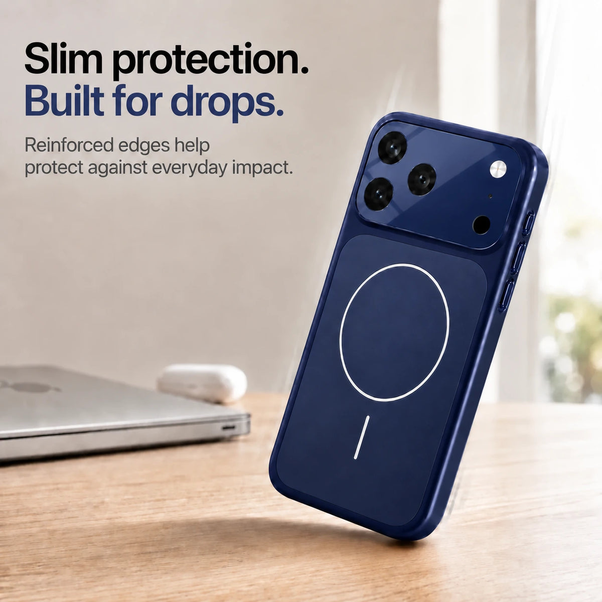 Deep blue slim phone case leaning on one corner on a wooden desk, showing reinforced edges #color_Deep Blue