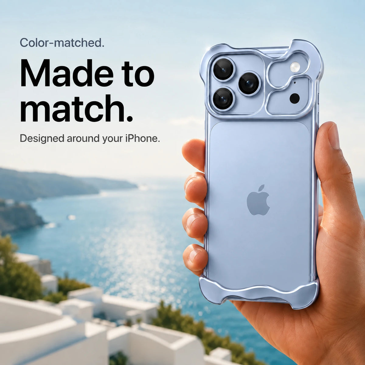 Glacier sculpted metal phone case held in a hand above a coastal background #color_Glacier
