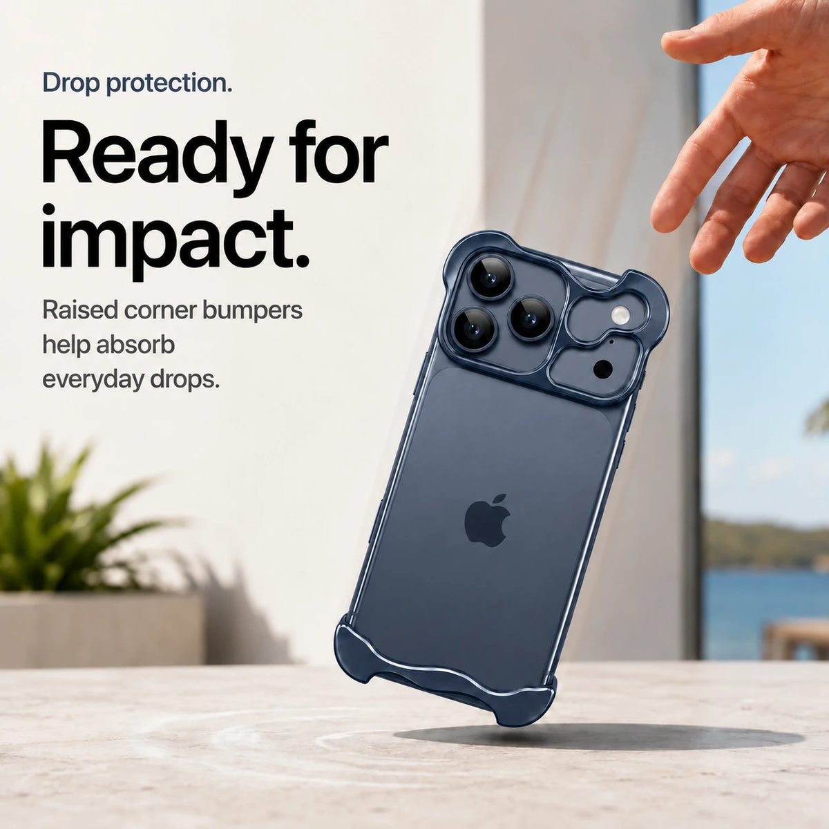 Navy blue sculpted metal phone case demonstrating raised corner protection during a drop #color_Deep Blue
