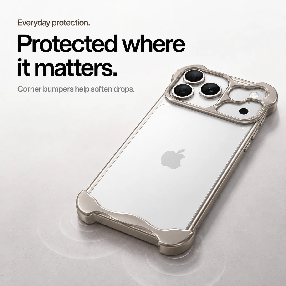 Warm gray sculpted metal phone case on a desk showing its protective corner bumpers #color_Natural Titanium